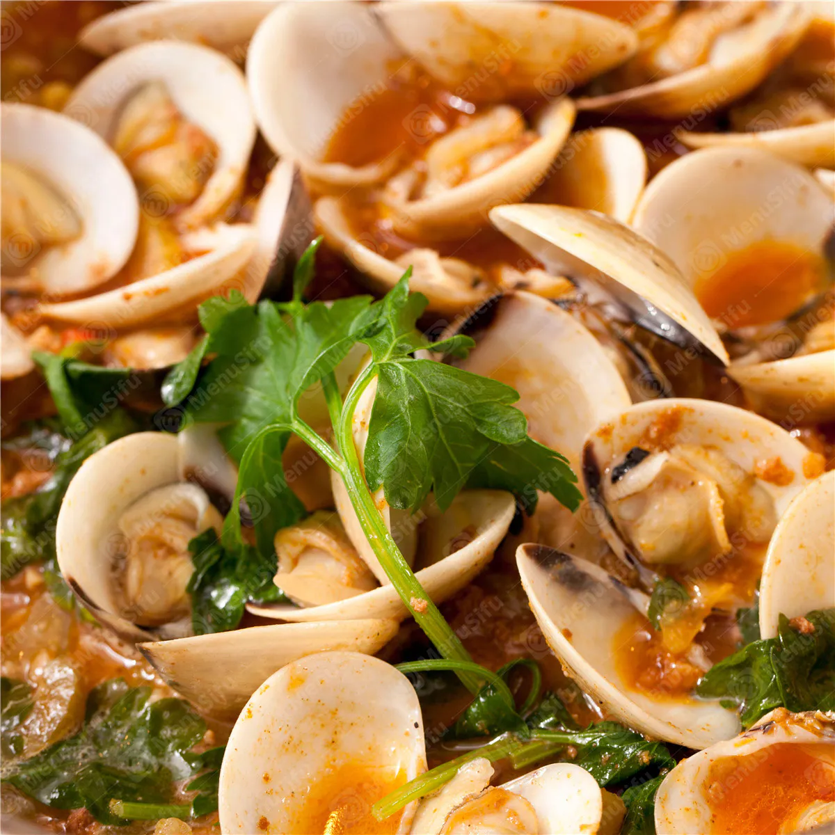 Steamed clams in rich tomato broth with fresh parsley garnish at Rock Seafood and Fried Crabhouse, a Seafood Restaurant in Baltimore